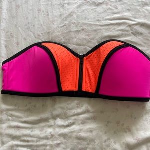 PINK Victoria’s Secret swimsuit top, pink and orange, zips up front. Sz M
